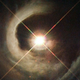 Illustration for article titled A Baby Star Pierces Through Its Blanket Of Interstellar Dust